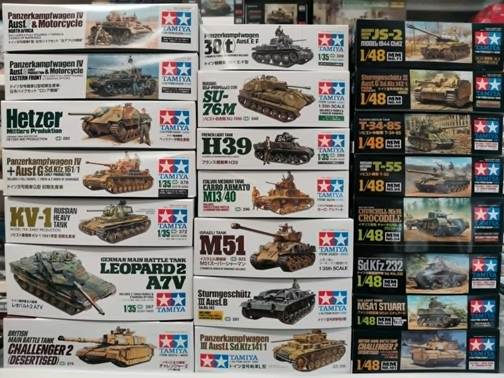 A stack of boxes with pictures of tanks

AI-generated content may be incorrect.
