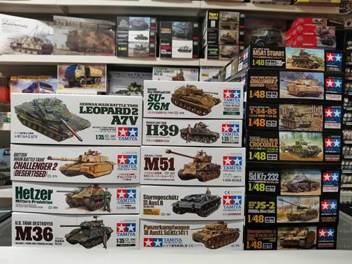 A stack of boxes with pictures of tanks
AI-generated content may be incorrect.