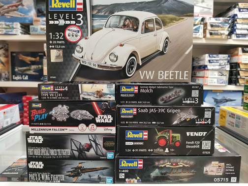 A stack of model building boxes
AI-generated content may be incorrect.