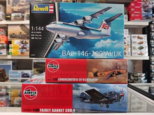 A stack of model airplanes on a shelf
AI-generated content may be incorrect.